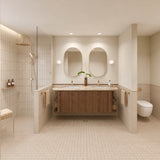 Large beige tiled bathroom with double timber vanity, two oval mirrors and walk-in shower