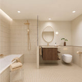 Long beige tiled bathroom with bath, walk-in shower and timber vanity