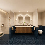 Large navy tiled bathroom with double timber vanity, two oval mirrors and walk-in shower
