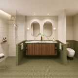 Large olive green tiled bathroom with double timber vanity, two oval mirrors and walk-in shower